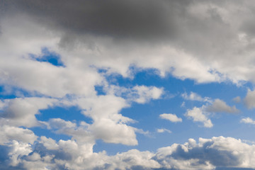 Blue sky and clouds. Dark clouds before the rain.