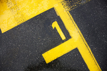 Number one sign on the road, motor race sign on the asphalt, the best pole position, review for the...