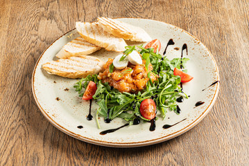 salmon tartar with arugula salad