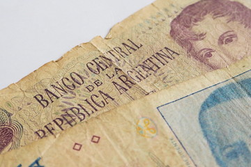 Peso and Austral currency bank notes of Argentina, South America for business, economy, investment, and finance concept
