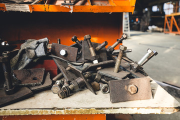 Rusty mechanisms and tools in the shop of an old abandoned factory.