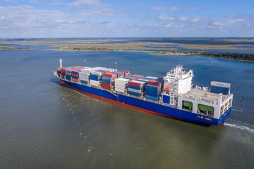 Large container ship entering port in Jacksonville, FL.