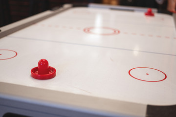 Table for playing air hockey. Close-up, selective focus.