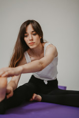 Young slender girl doing yoga