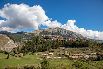 Landscape of the village of Opi and the Marsicano Moun with cloud in background. Abruzzo, Lazio and Molise National Park, Italy