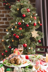 selective focus of wine glass and christmas gift on table