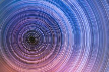 Beautiful starry sky with star trails orientation on the north star. Space background. Abstract long exposure background.
