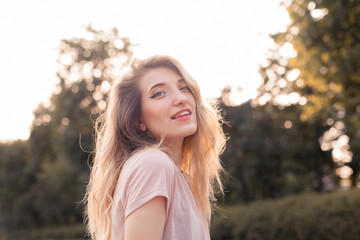 Fototapeta premium Portrait of happy young woman outdoors.