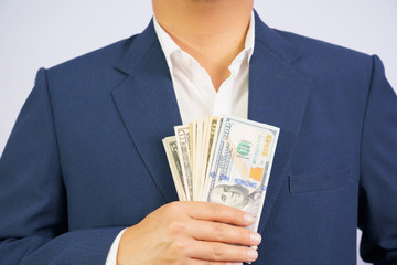 Money us dollar hold on hand business man wearing a blue suit USD, Pay, exchange money on white background.