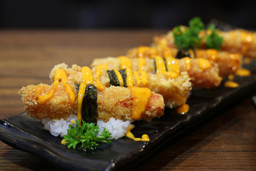 Close up Crab meat sticks tempura with sauce on black plate, Japanese food style