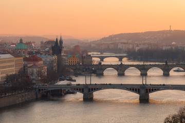 Golden sunset light over old bridges of Prague, Czechia