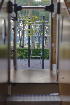 Steps And View Through The Children's Slide, Subjective Camera. Visible To The Cage And Playground. Europe, Italy, Summer.