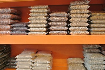 Whole grains in plastic bags placed on shelves to sell products