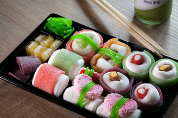 Sushis made of sweets in a bento box