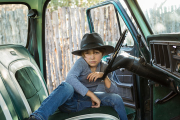 6 year old boy  in 1970's era pick up truck