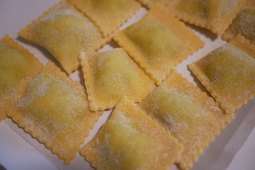 Raw ravioli pasta on a tray