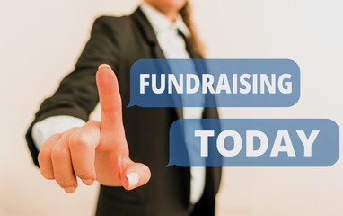 Text sign showing Fundraising. Business photo text act of collecting or producing money for a particular purpose Digital business in black suite concept with business woman
