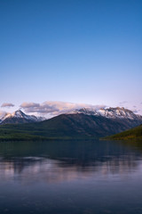 Fototapeta na wymiar The amazingly beautiful Kinkla Lake with the snow covered mountains in the background at Sunset, Glacier Park, Montana.