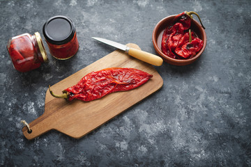 Roasted red pepper on dark background.