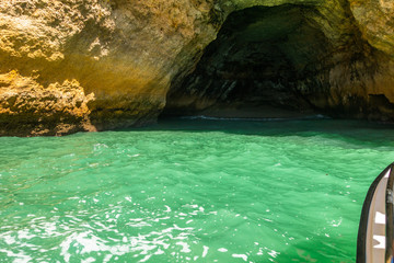 Boat tour visiting the caves along Algarve coastline near the famous Benagil cave, Portugal