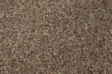 surface small pebbles of different colors in cement