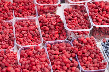 Boxes with raspberry from farmers market. Vitamin healthy food ready to eat
