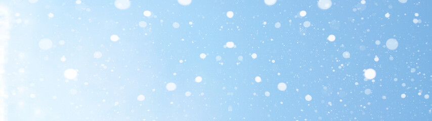 Fototapeta premium Winter christmas sky with falling snow -background panorama long banner