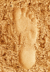 Footprints in sand at the Beach