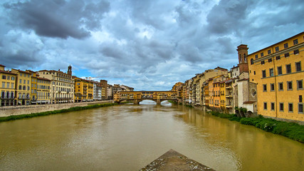 Obraz premium Ponte Vecchio bridge across Arno river in Florence, Italy. View from Ponte Santa Trinita