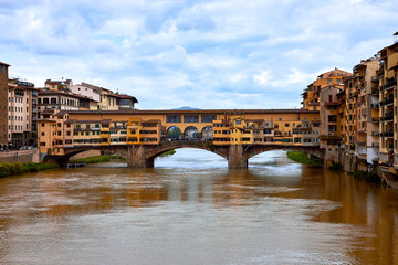 Obraz premium Ponte Vecchio bridge across Arno river in Florence, Italy. View from Ponte Santa Trinita