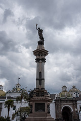 Fototapeta na wymiar Libertas on top of a triumph column in Quito