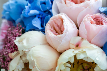 Beautiful bouquet of flowers with amazing pink and creamy peonies. Background of gentle peony flowers.
