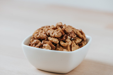 Image of walnuts in a square bowl.