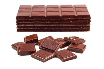 Dark Chocolate Tablet Stack and Bars. Isolated on white backgrou