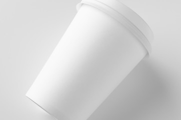 12 oz. white coffee paper cup mockup with lid.