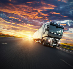 European truck vehicle with dramatic sunset light - obrazy, fototapety, plakaty