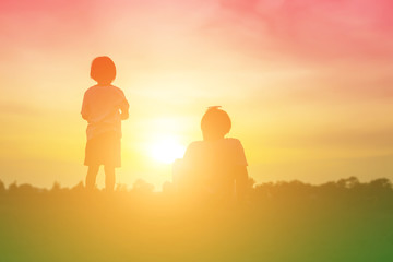 kid silhouette,Moments of the child's joy. On the Nature sunset