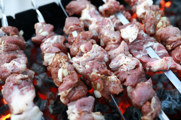 Cooking pork kebabs on skewers