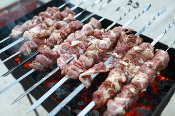 Cooking pork neck kebab on skewers