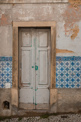 Traditional Portuguese Lisbon house facade with old doors