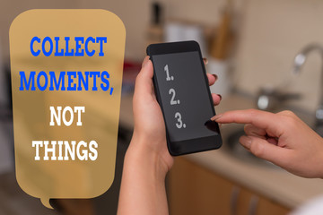 Writing note showing Collect Moments Not Things. Business concept for Happiness philosophy enjoy simple life facts woman using smartphone and technological devices inside the home