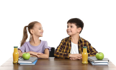 Fototapeta premium Happy children with healthy food for school lunch at desk on white background