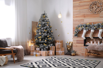 Stylish room interior with beautiful Christmas tree and decorative fireplace