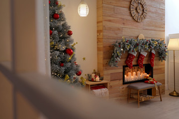 Stylish room interior with decorative fireplace. Christmas time