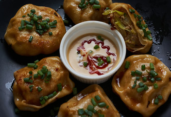 Roasted pork bun serving with dipping sauce