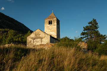 Old chapel St. Sisinius in Laas on a sunny evening in summer