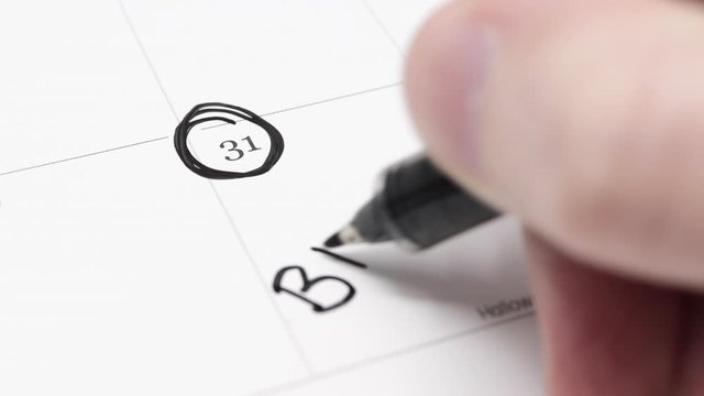 A hand writes BREXIT? on the 31st day of October on a calendar. 31st October 2019 is the deadline for Brexit, Britain&rsquo;s exit from the European Union. 