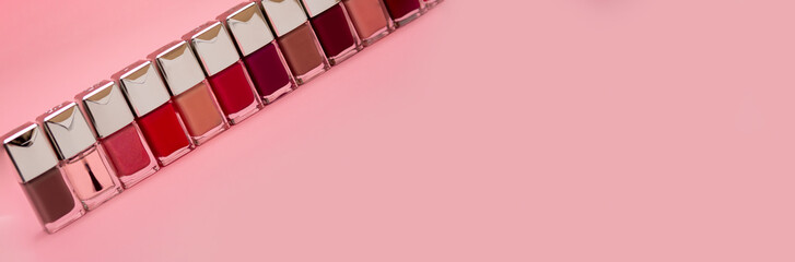nail polishes on pink background