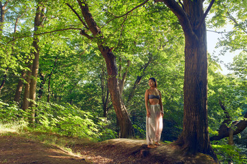 Young asian woman resting after yoga in the forest. Beautiful portrait of yoga. Outdoors lifestyle...