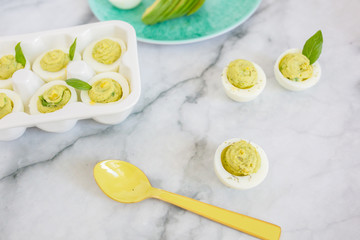 Avocado Deviled Eggs on Blue Plate